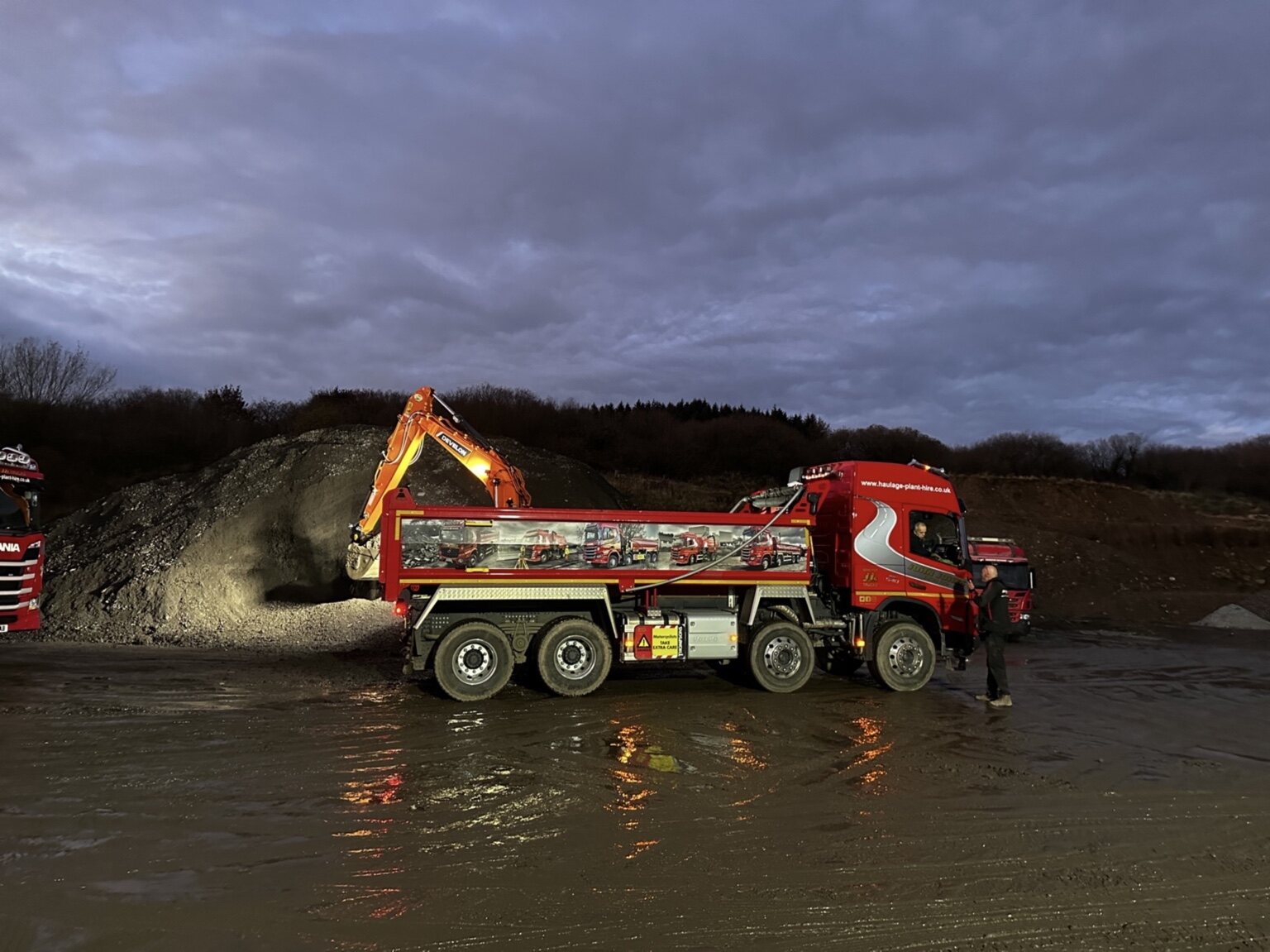 Aggregate tipper lorry being loaded at a material site