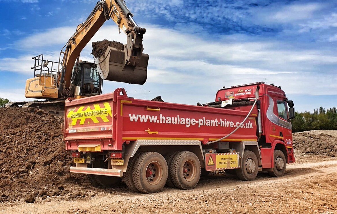 Tipper lorry being loaded with excavated muck away material