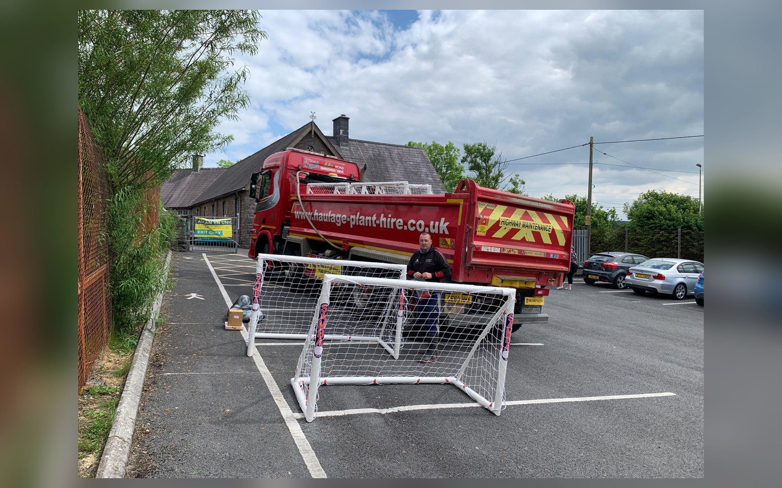 Goal posts and John Jones lorry supporting youth sport